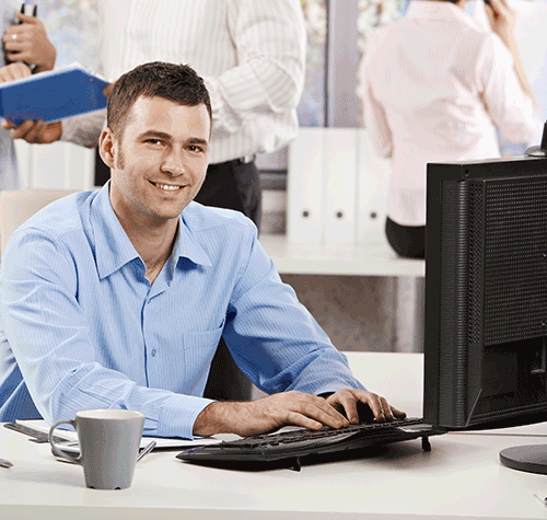 Sintelix customer support staff at computer 